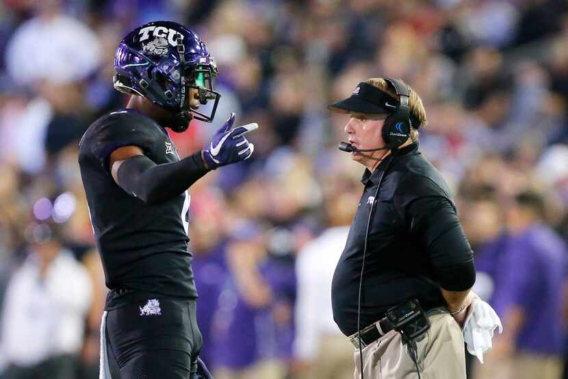 TCU Horned Frogs head coach Gary Patterson visits with his quarterback Shawn Robinson (3)...