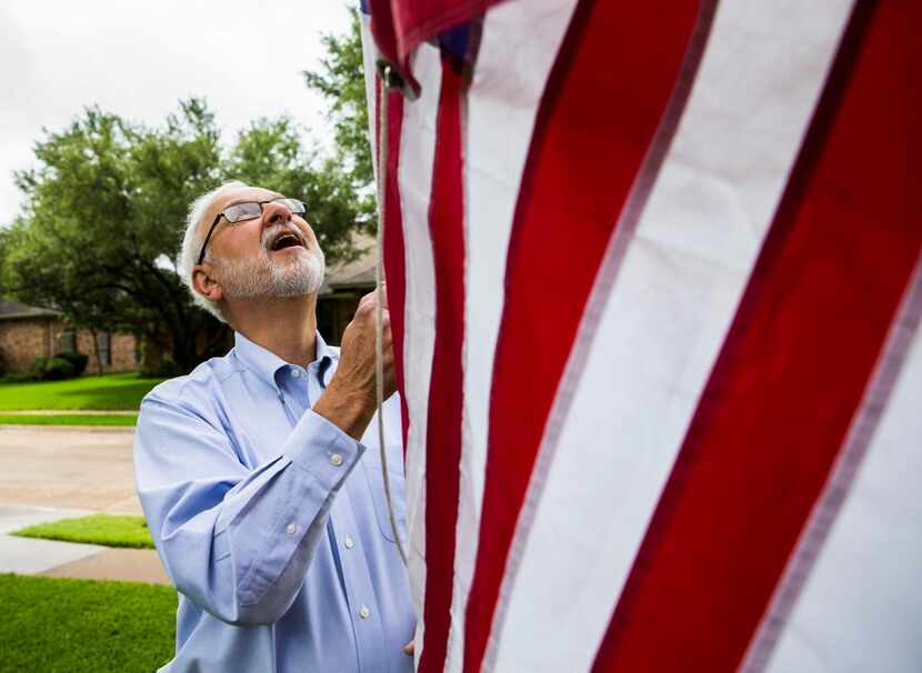 
Allen Mesch raises an American flag outside his Plano home. He started visiting Civil War...
