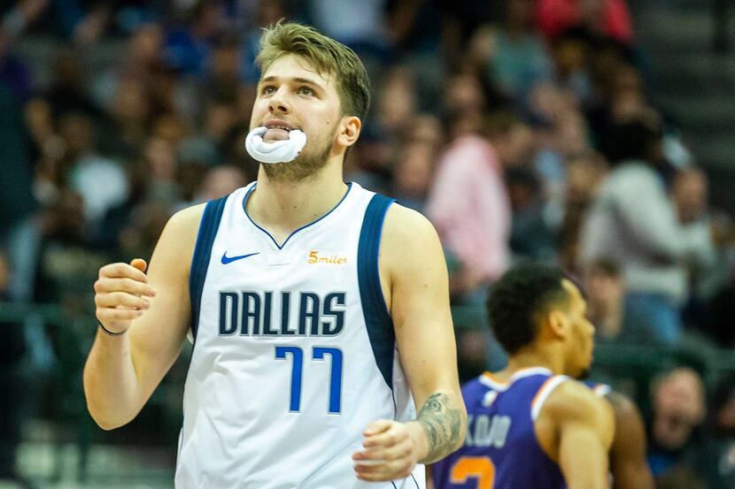 Dallas Mavericks forward Luka Doncic reacts after a foul was called against the Phoenix Suns...