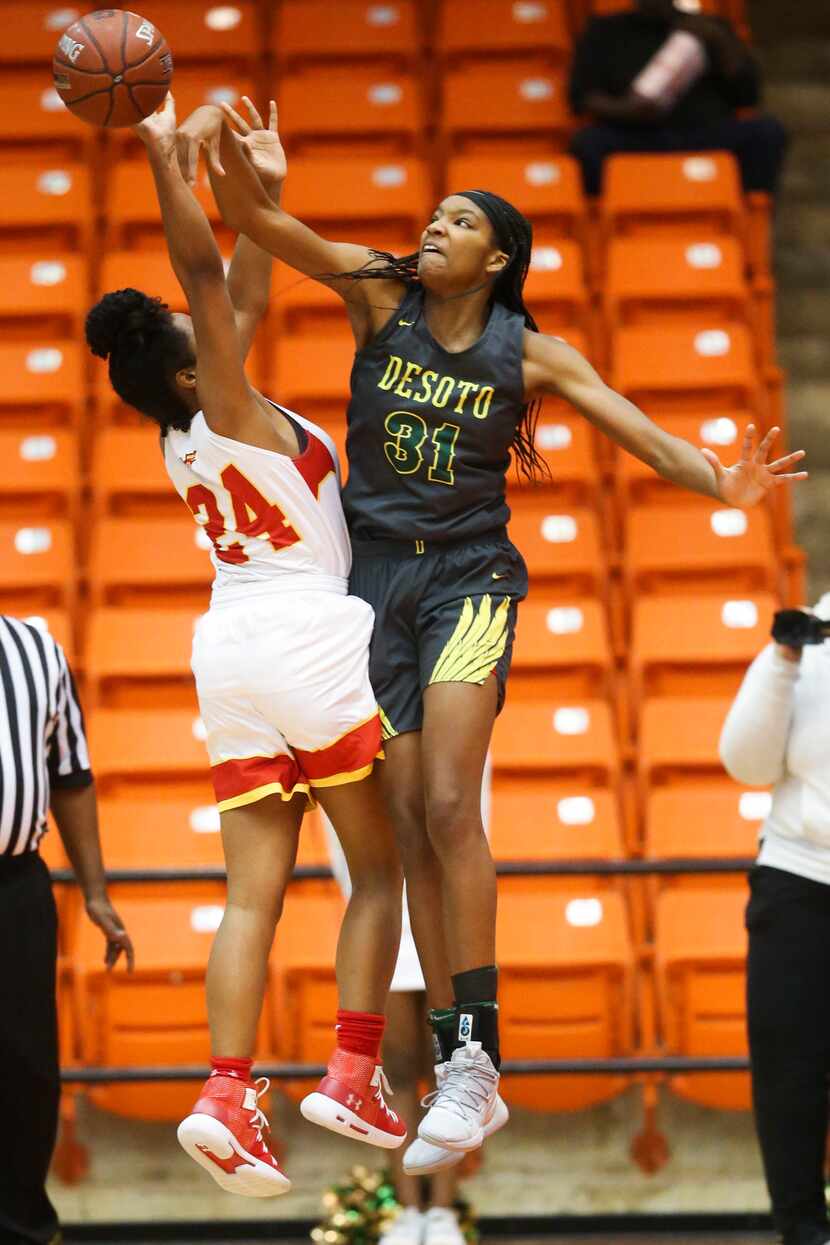 South Grand Prairie guard Vasana Kearney (24) gets her shot blocked by DeSoto forward...