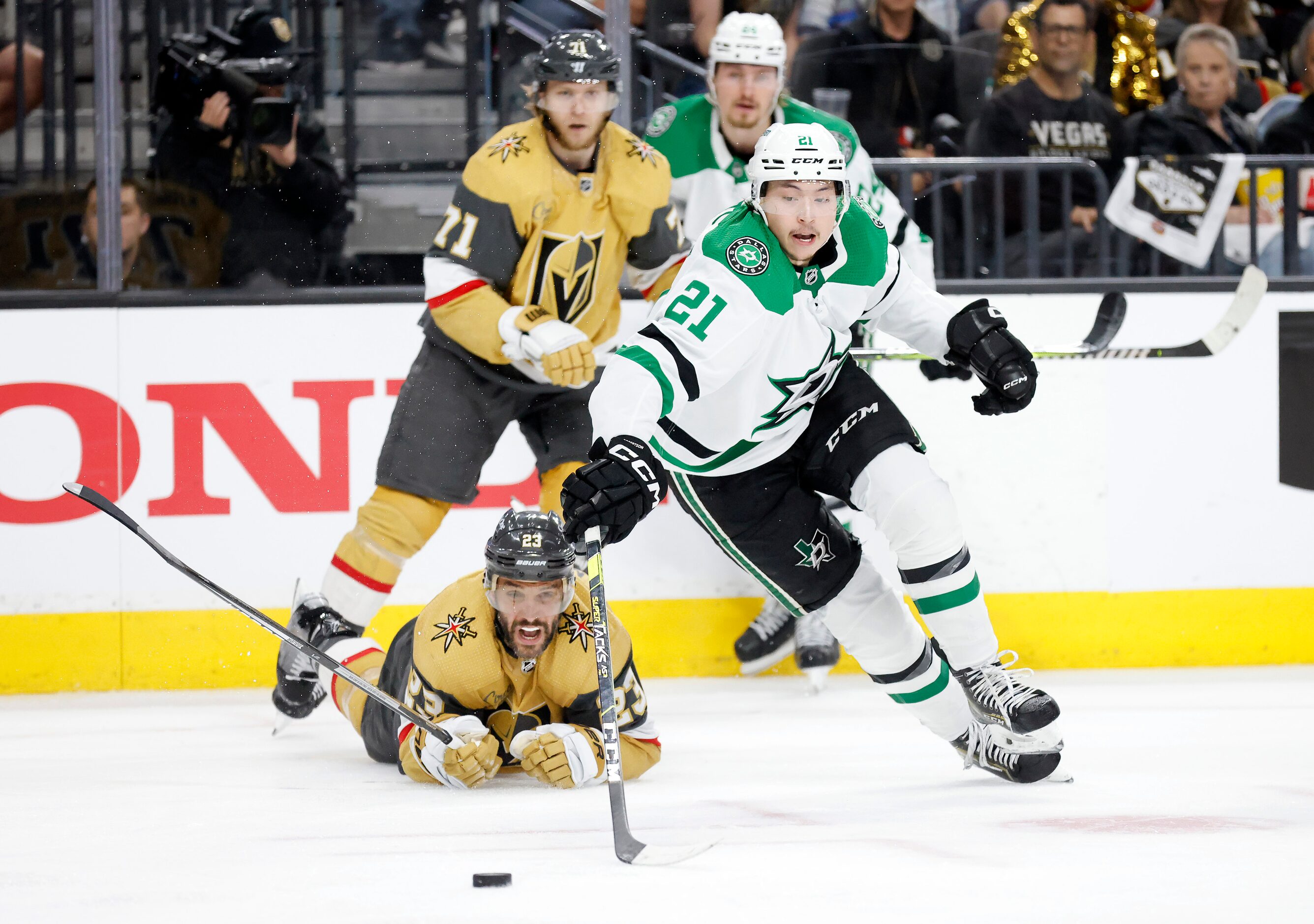 Dallas Stars left wing Jason Robertson (21) takes control of the puck after battling Vegas...