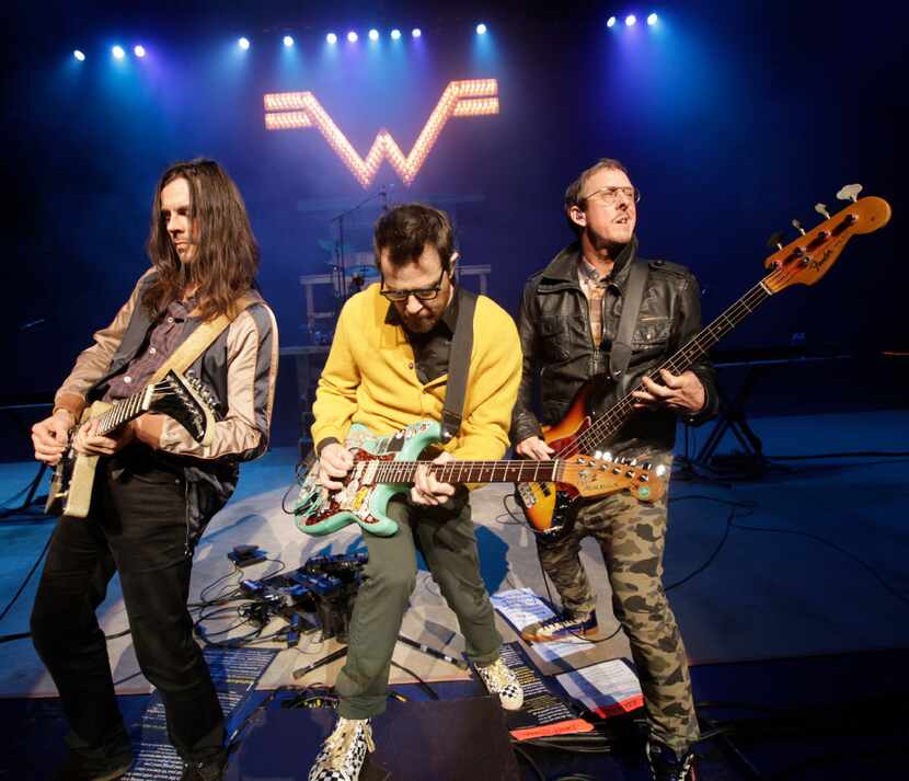 Weezer performs during the "How The EDGE Stole Christmas" show at Verizon Theatre in Grand...