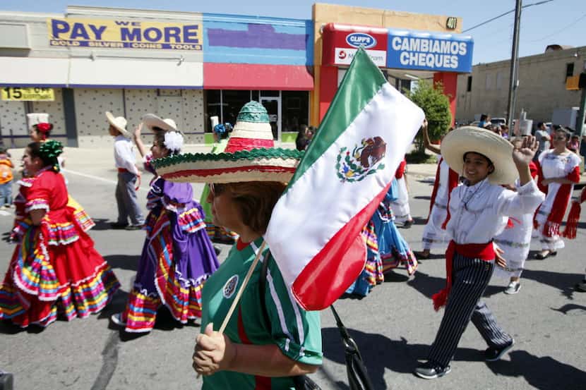 Gloria Reyes walks with a sombrero and Mexican flag during the 24th Annual Cinco de Mayo...