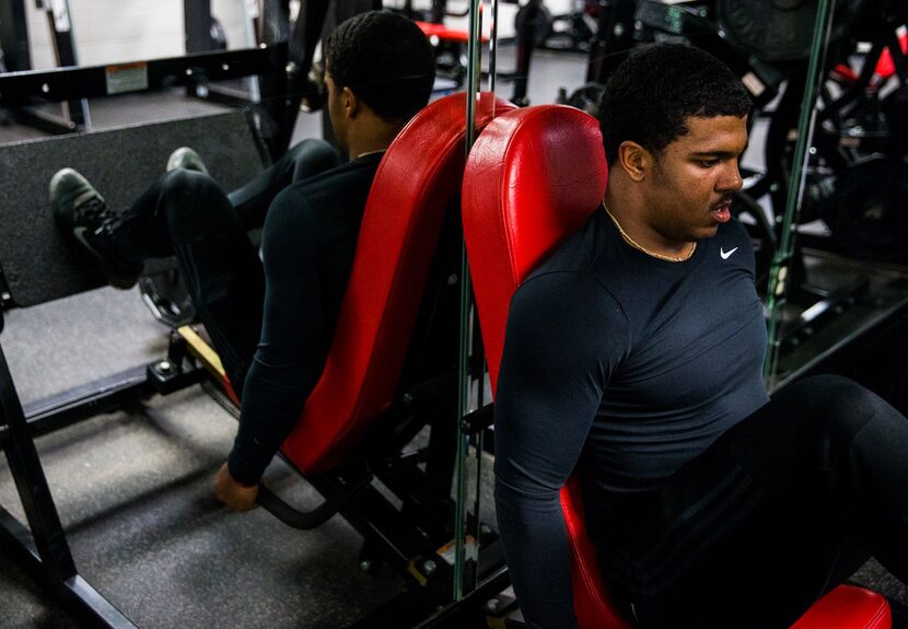 Mansfield Legacy football player Jalen Catalon works out in the weight room on Thursday,...