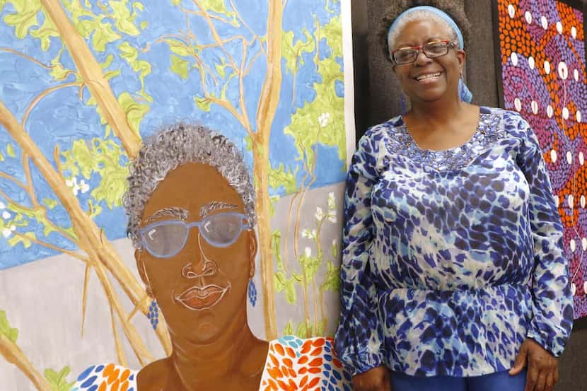 
Florence Hawkins-Criss stands next to her artwork at Baylor Jack and Jane Hamilton Heart...