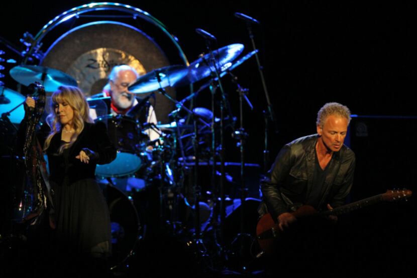Stevie Nicks, Mick Fleetwood and Lindsey Buckingham, left to right, play American Airlines...