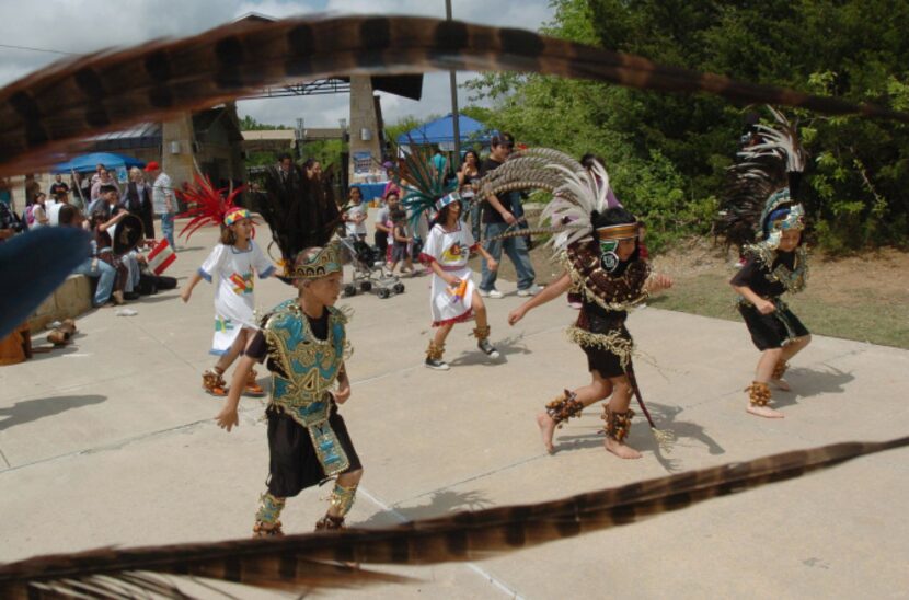 Ollin-Tonalzin, a tradional Aztec dance group perform for people during the third annual...