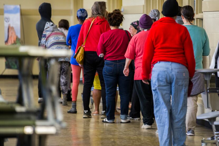 People waited in line for mail at Austin Street Center, which provides shelter and services...