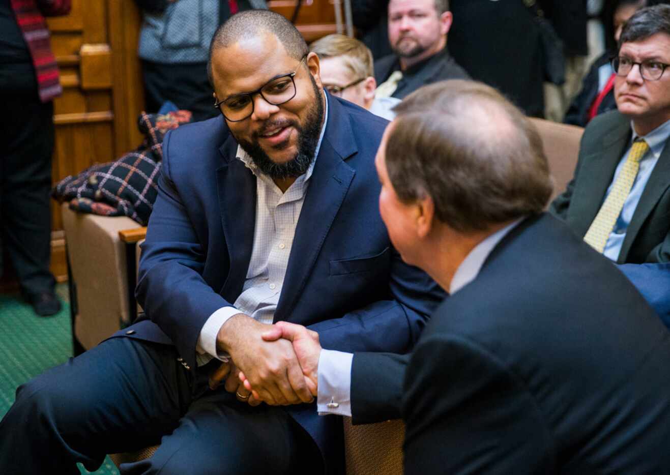 State Rep. Eric Johnson of Dallas shook hands with Bruce Bugg, Chairman of the Texas...