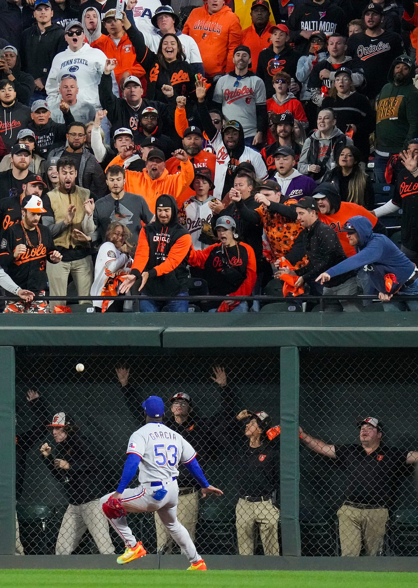 Texas Rangers right fielder Adolis Garcia chases down a double off the bat of Baltimore...