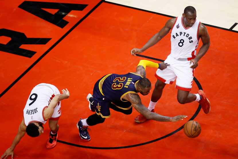 TORONTO, ON - MAY 27:  LeBron James #23 of the Cleveland Cavaliers gains posession against...