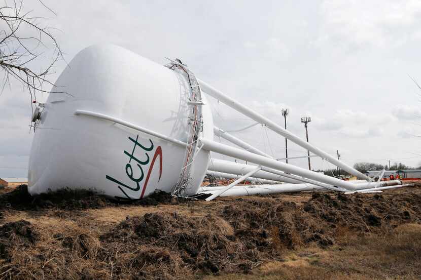 The tornado damaged Martha Lane water tower was taken down in Rowlett on Monday, February 6,...