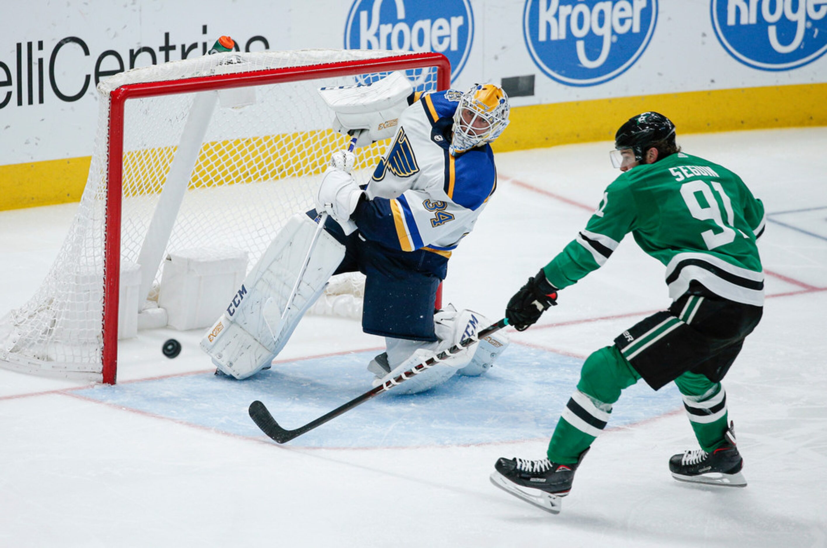 St. Louis Blues goaltender Jake Allen (34) clears the puck in front of Dallas Stars forward...