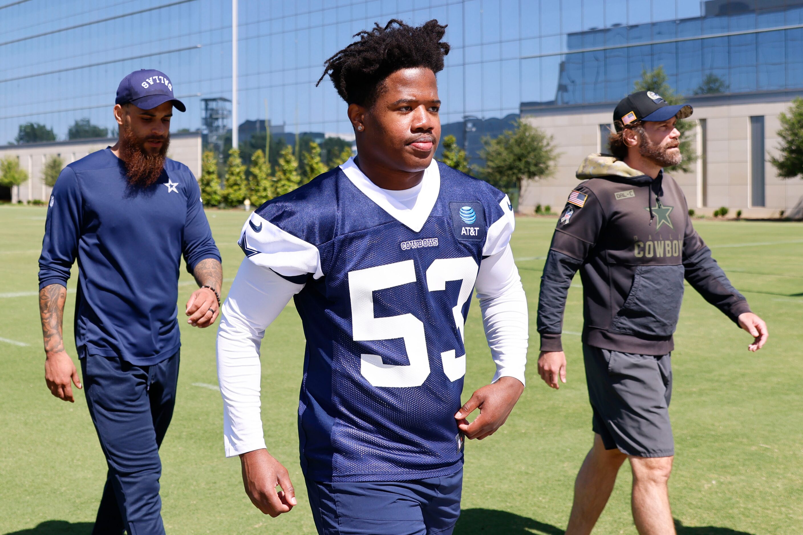 Dallas Cowboys linebacker Jason Johnson exits the field following a rookie minicamp, on...