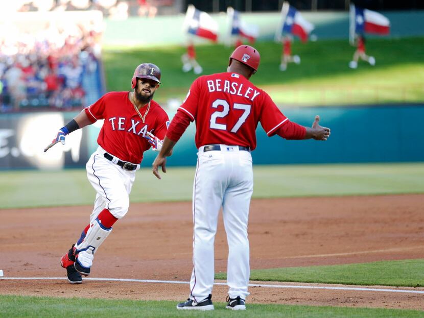 Texas Rangers second baseman Rougned Odor (12) celebrates with Texas Rangers third base...
