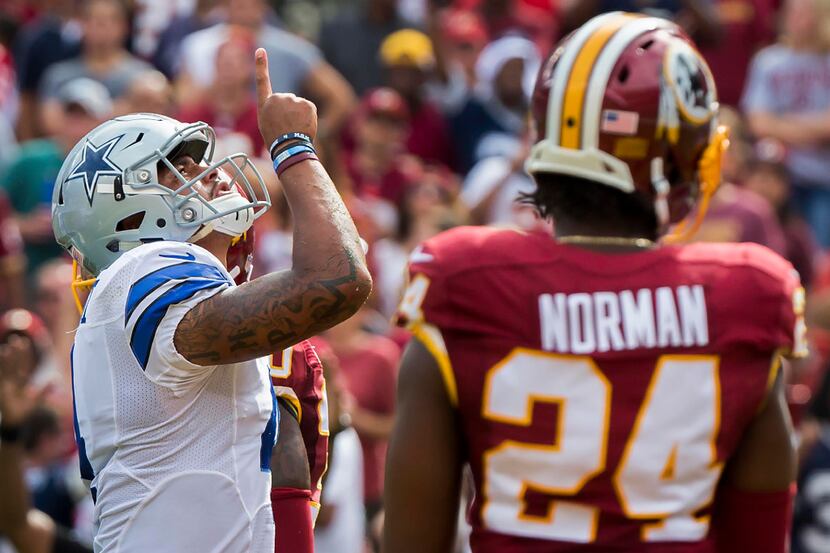 Dallas Cowboys quarterback Dak Prescott (4) celebrates after scoring on a 6-yard touchdown...