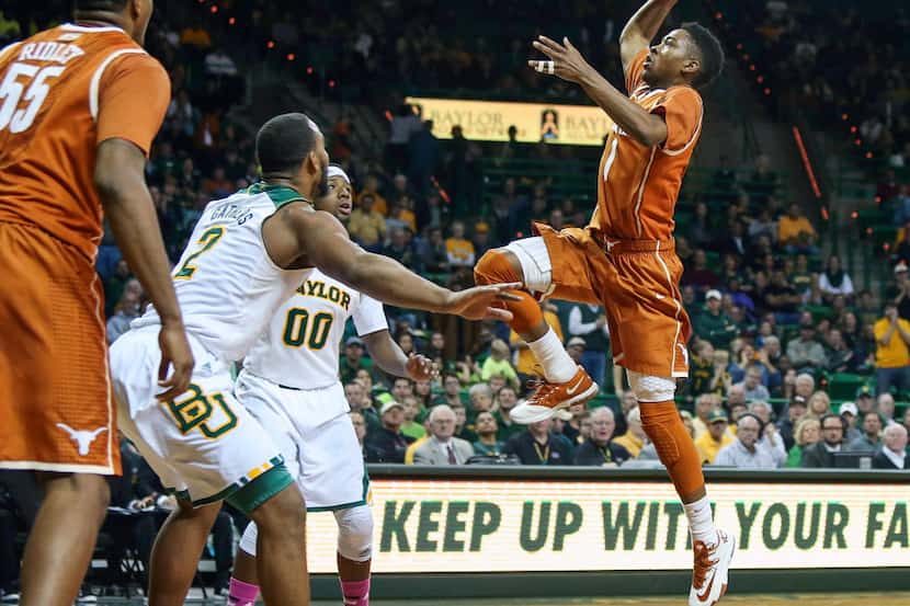 Texas guard Isaiah Taylor (1) shoots over Baylor forward Rico Gathers (2) during the first...