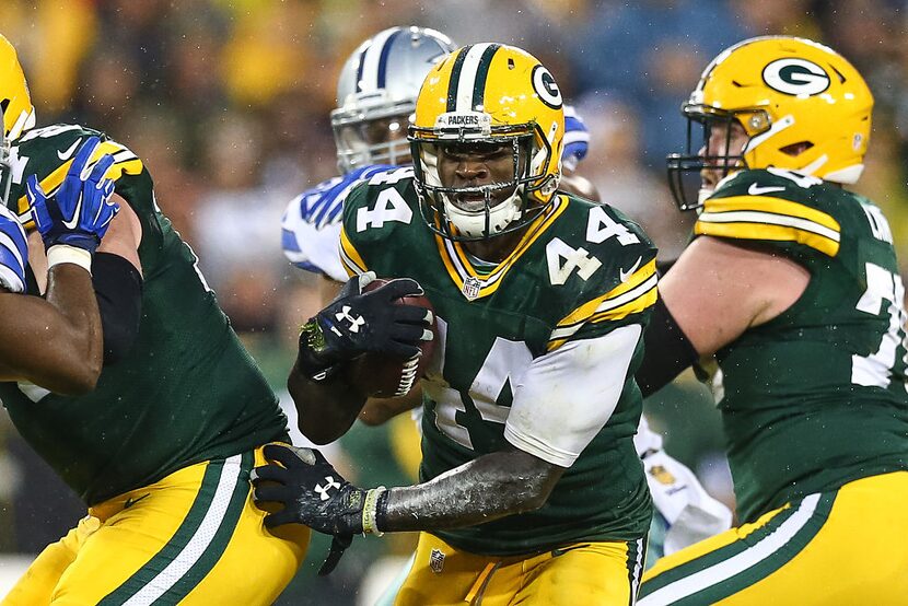 GREEN BAY, WI - DECEMBER 13:   James Starks #44 of the Green Bay Packers carries the...