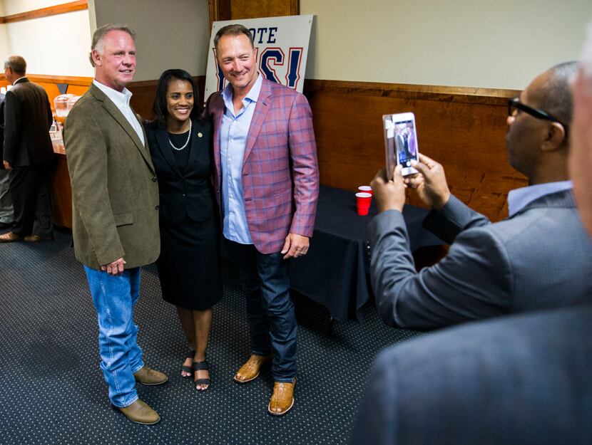Arlington NAACP president Alisa Simmons has her photo taken with Texas Rangers bench coach...