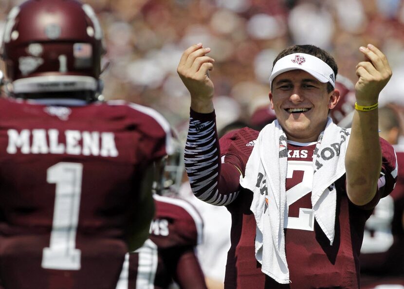 Texas A&M Aggies quarterback Johnny Manziel (2) celebrates a touchdown by  running back Ben...