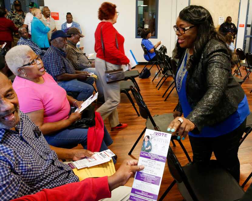 Council candidate Yolanda Faye Williams visits with voters at a candidate forum held by the...