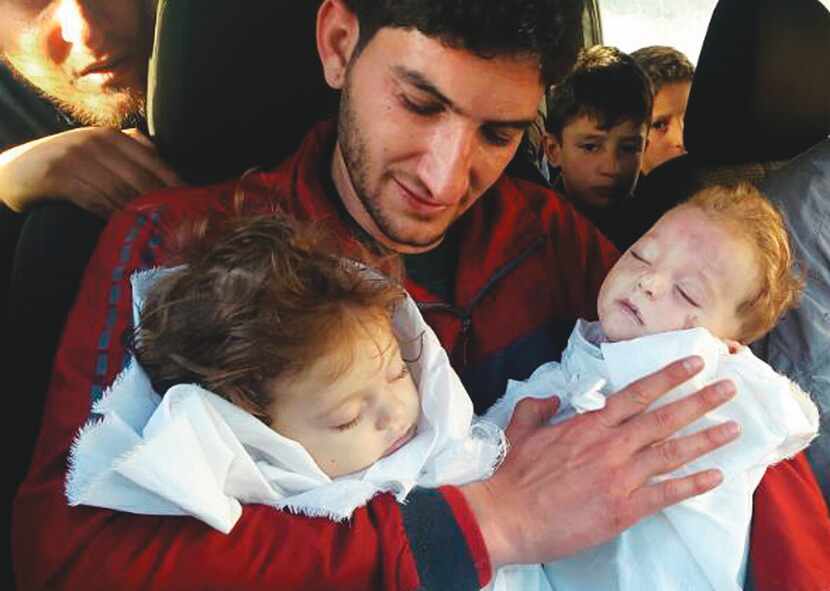In this picture taken on Tuesday April 4, 2017, Abdul-Hamid Alyousef, 29, holds his twin...