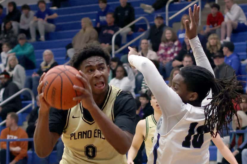 Plano East forward DJ Hall (0), left, drives the lane against the defense of Plano West...