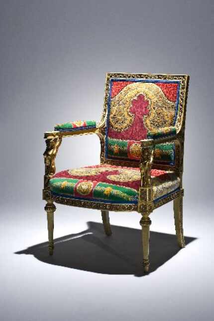 One of a pair of Empire-style armchairs clad in fabric given to Osborn by fashion legend...