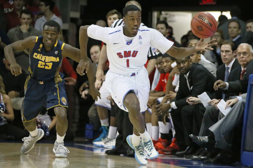 SMU's Ryan Manuel (1) grabs a loose ball and races to the offensive end as California's...