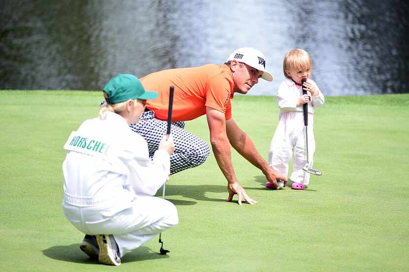 AUGUSTA, GEORGIA - APRIL 06:  Billy Horschel of the United States plays with his daughter...