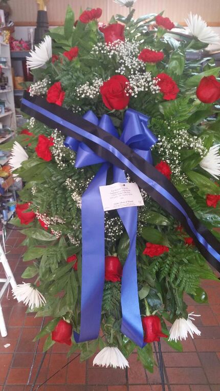 This arrangement of flowers was made by Dallas House of Flowers for slain Dallas police Sgt....