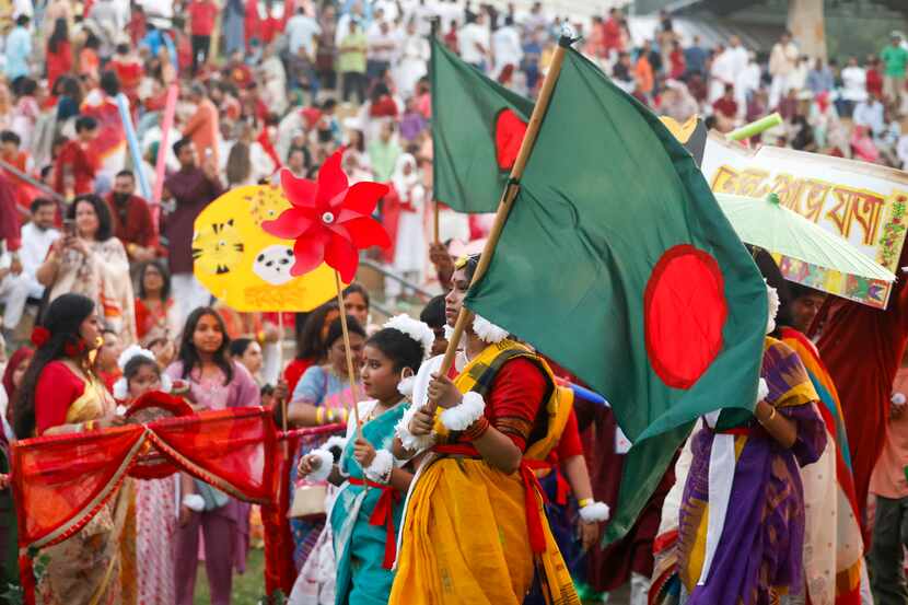 Bangladesh Association Of North Texas members carry out a procession around Red Tail...