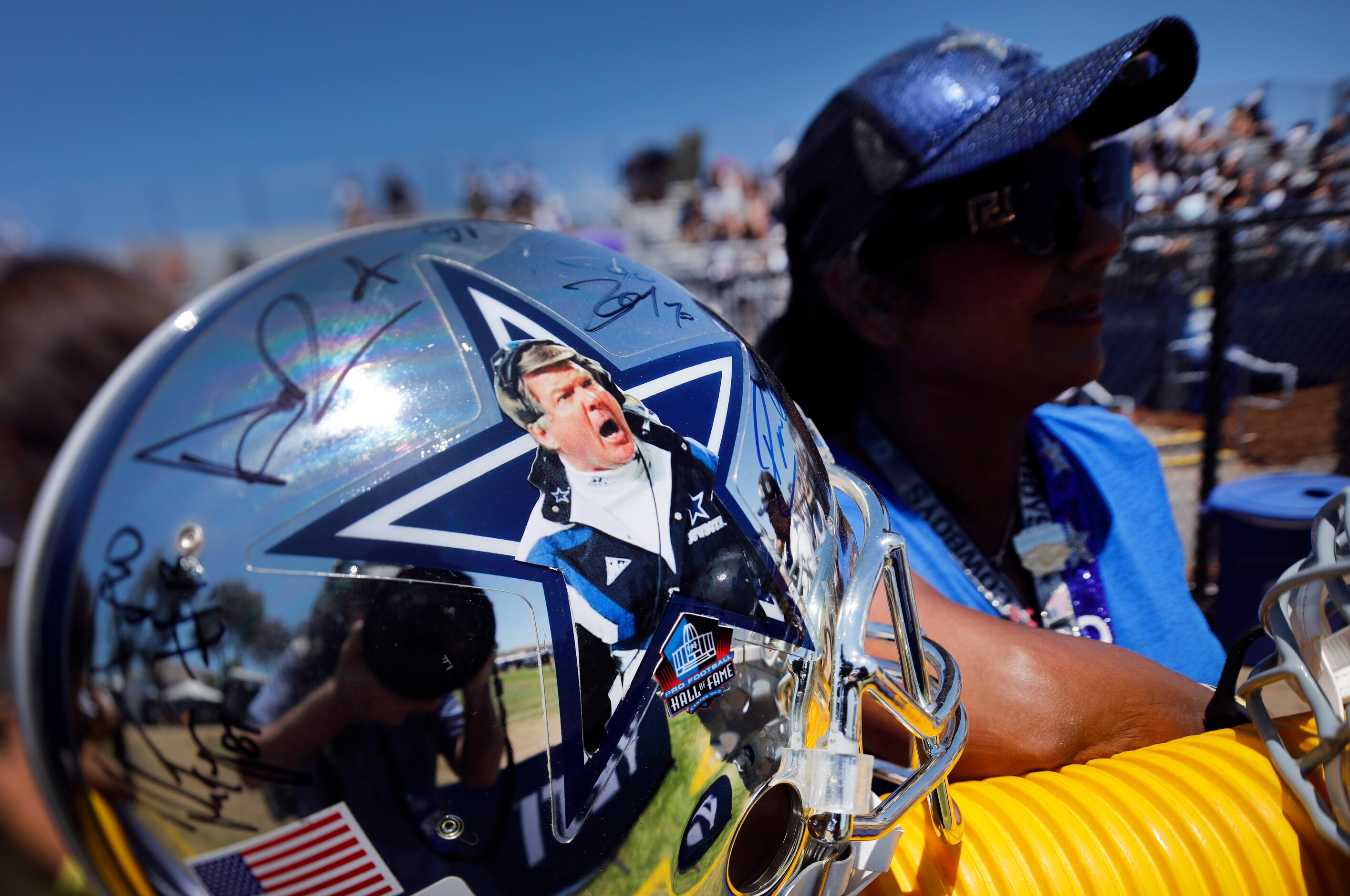 A Dallas Cowboys fan brought a mirrored helmet bearing former head coach Jimmy Johnson’s...