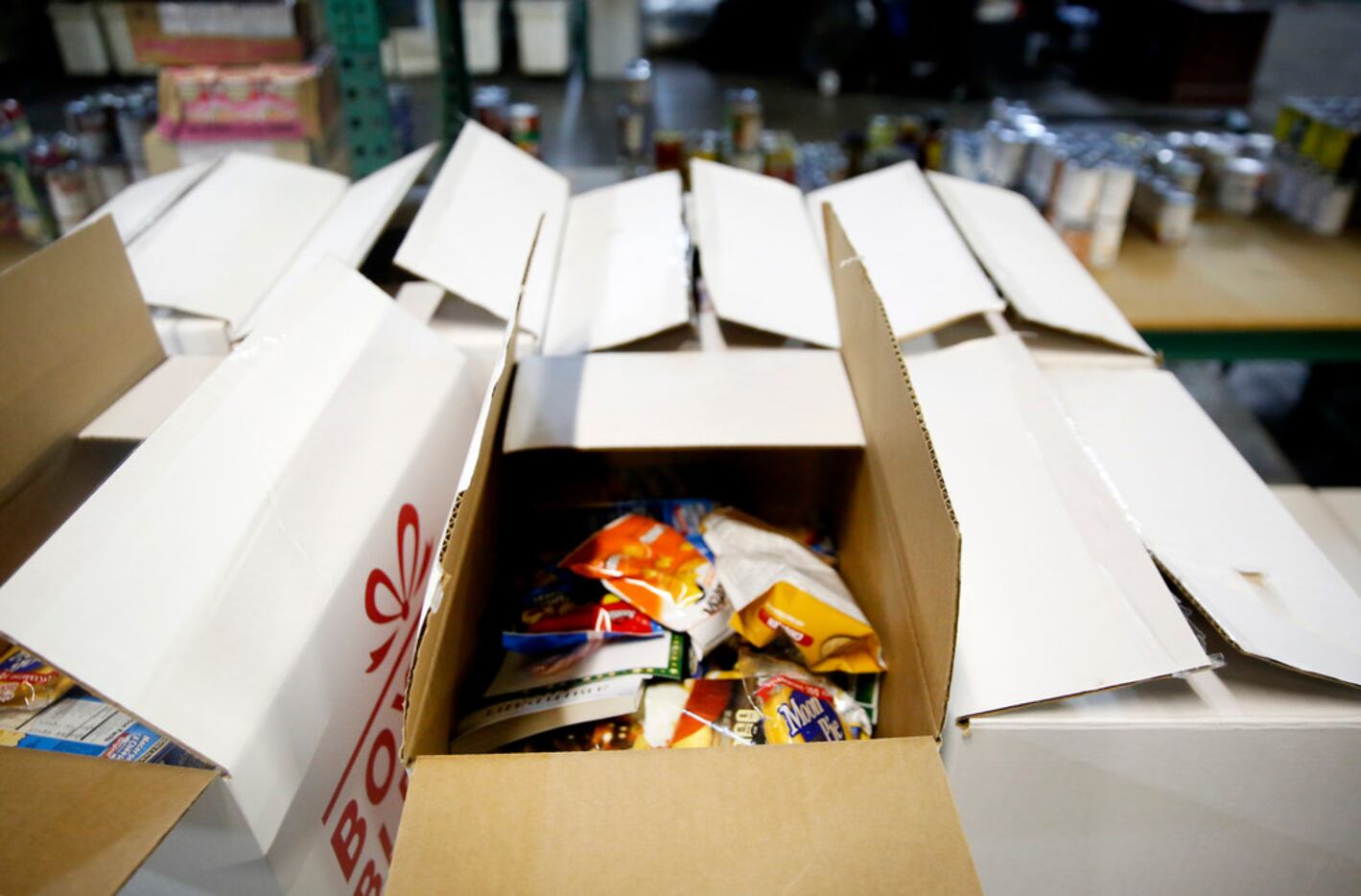 Boxes filled with nonperishable items at The Salvation Army in Dallas on Friday, Jan. 25,...