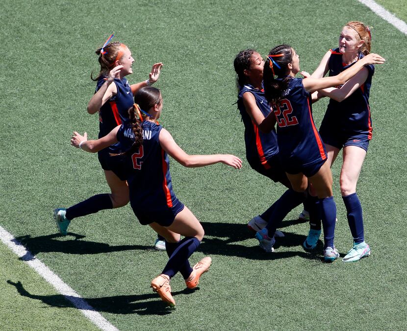 Frisco Wakeland's Ava Yocum (8), right, braces for a celebration with teammates after she...