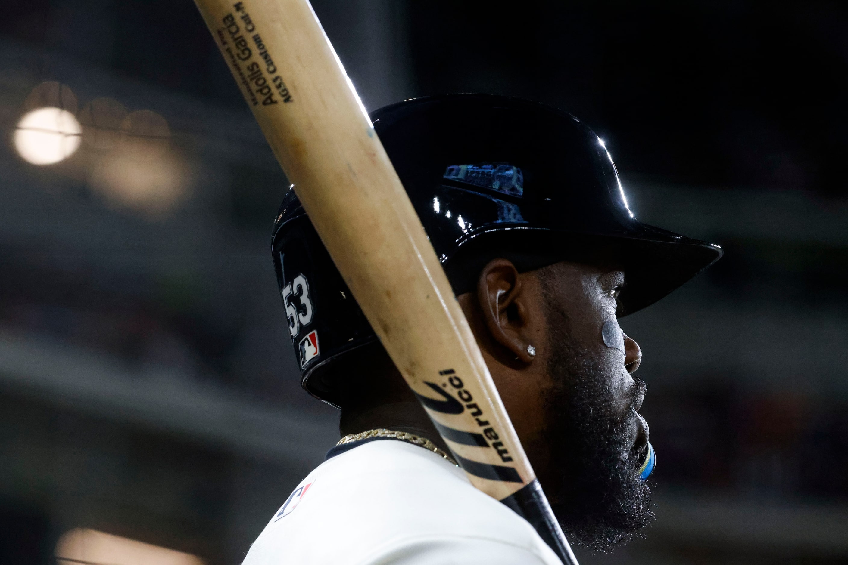 Texas Rangers right fielder Adolis Garcia waits in the dugout during a baseball game against...