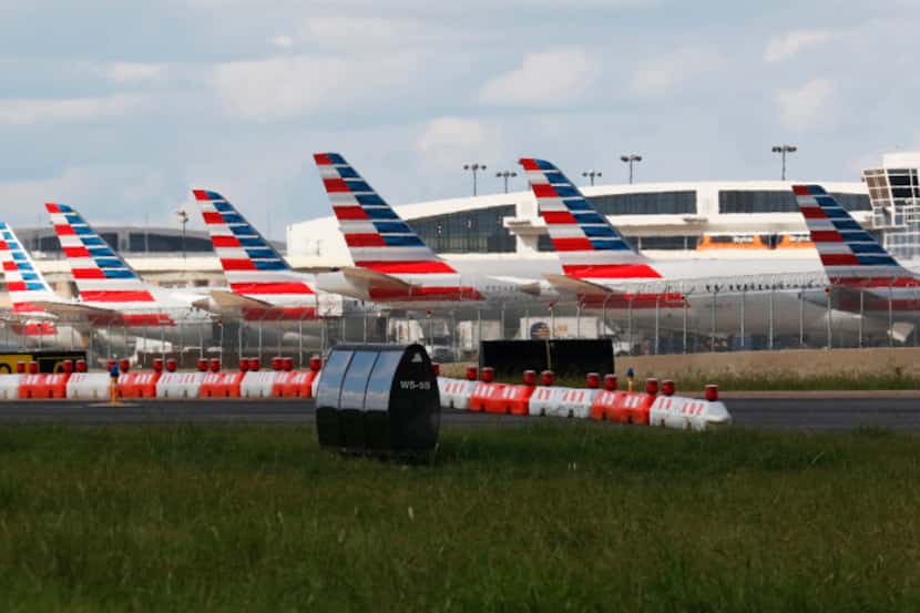 American Airlines airplanes parked at DFW International Airport on Wednesday, August 23, 2017.