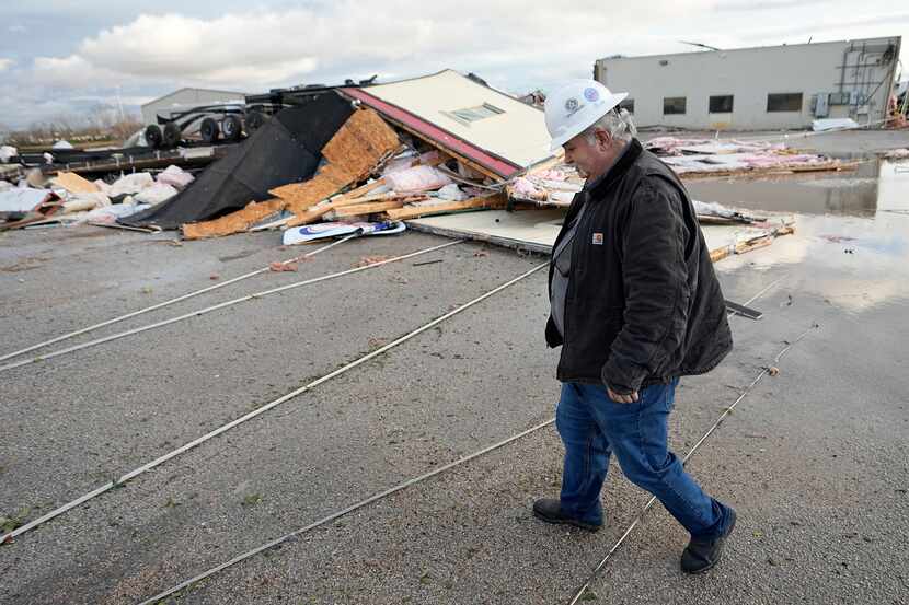 Johnny Graham walks past his storm-damaged office on Tuesday, Jan. 24, 2023, in Pasadena,...