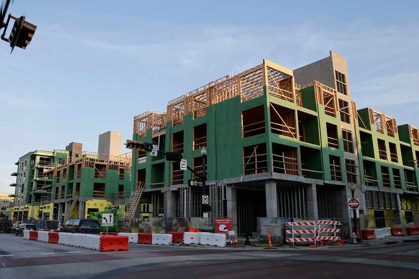 Apartments under construction at the intersection of 14th street and Avenue K in Plano,...