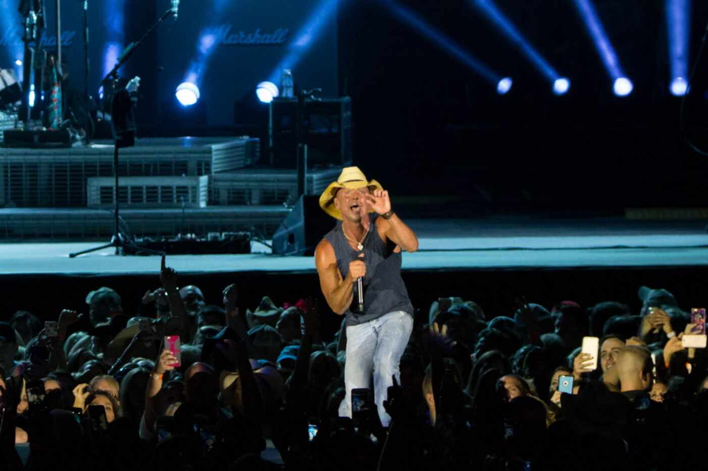 Kenny Chesney performs on stage during the his Spread the Love Tour concert at AT&T Stadium...