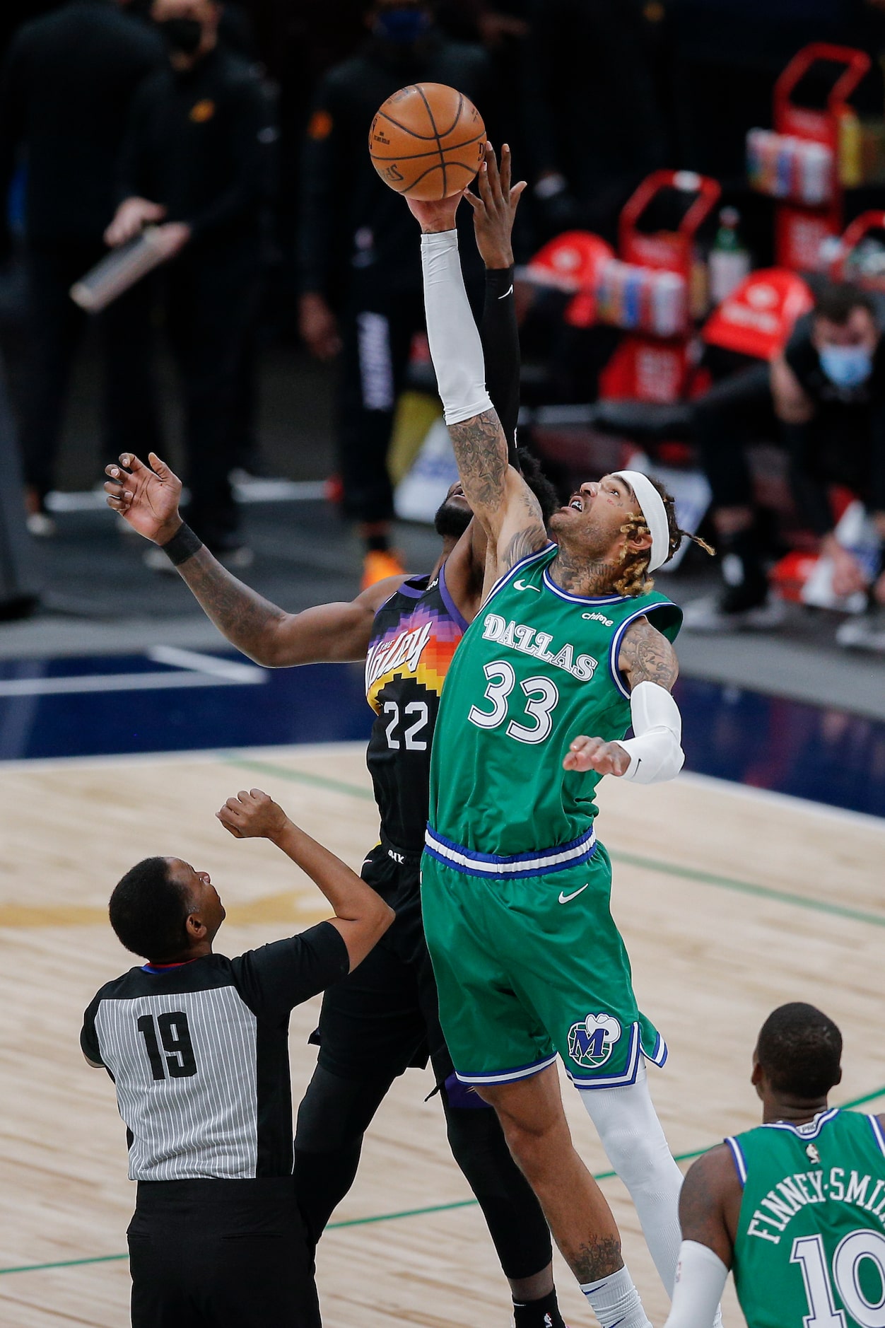 Dallas Mavericks forward Willie Cauley-Stein (33) wins the opening tip off against Phoenix...