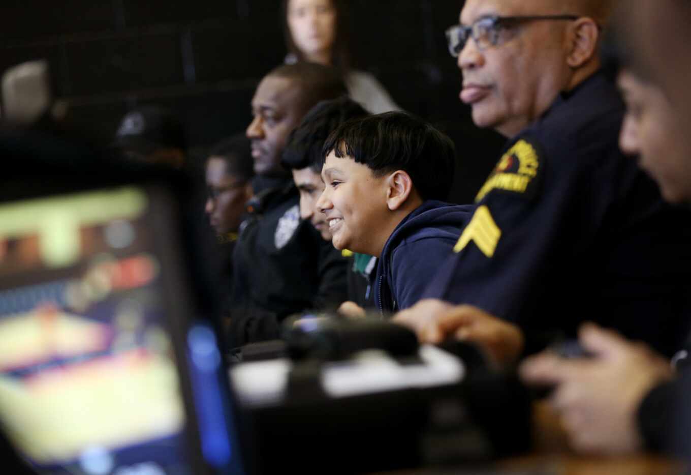 Eighth-grader Carlos Plietez plays a video game at a Mavs Gaming session at Sam Tasby Middle...