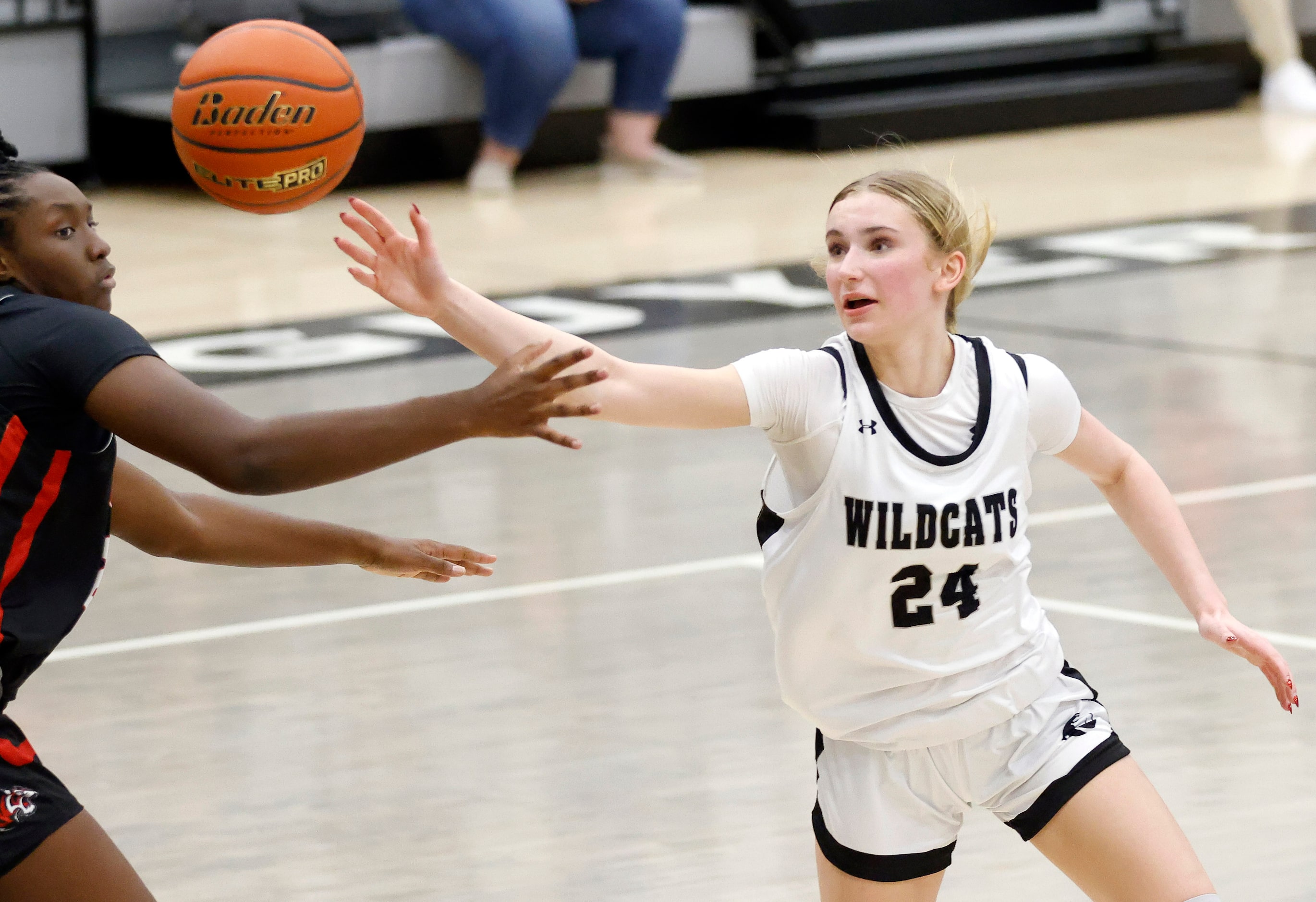 Denton Guyer guard Peyton Underwood (24) reaches for the basketball as she battled Denton...