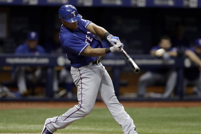 Texas Rangers' Adrian Beltre connects for a home run off Tampa Bay Rays relief pitcher Ryan...