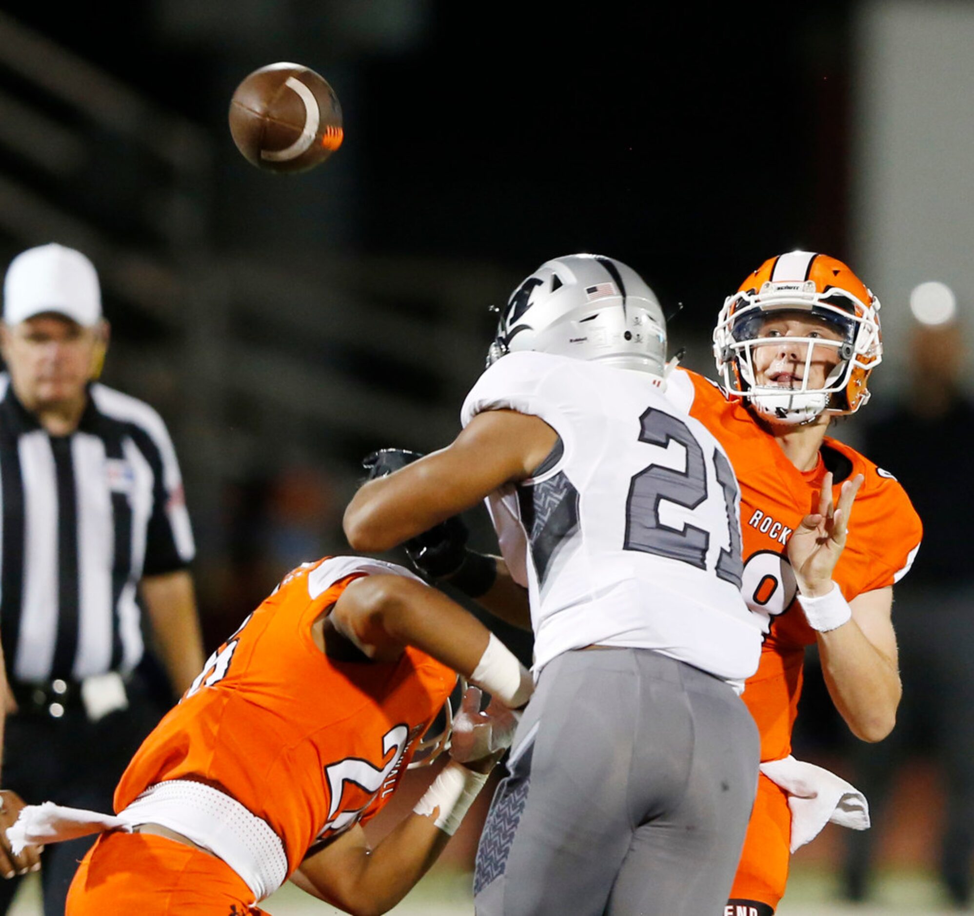 Rockwall's Braedyn Locke (8) attempts a pass in a game against  Arlington Martin High School...