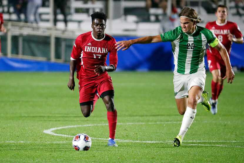 Indiana's Herbert Endeley (17) is challenged by Marshall's Max Schneider (23) during the...