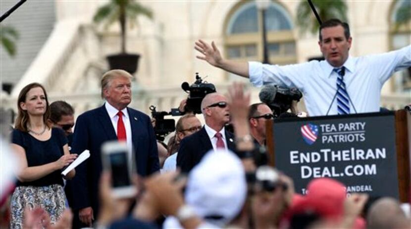 Donald Trump listens as fellow GOPÂ presidential candidate Sen. Ted Cruz speaks at a rally...