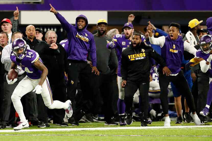 Minnesota Vikings receiver Stefon Diggs scores a 61-yard touchdown to win the game against...