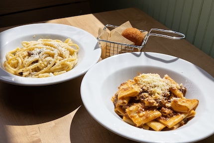 Carbonara (on left) is on the menu at Due' Cucina, along with fried appetizer arancini...