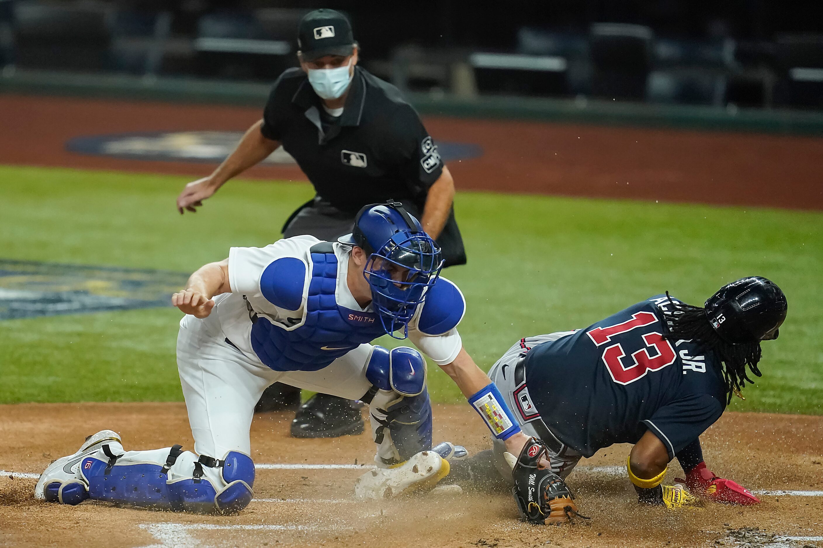 Atlanta Braves right fielder Ronald Acuna Jr. (13) scores on a single by designated hitter...